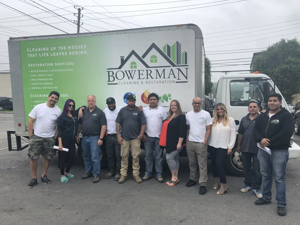 Bowerman Cleaning & Restoration team in front of their work truck