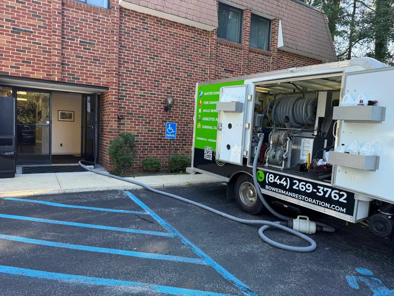 Bowerman Cleaning and Restoration truck at an Armonk, NY dental office for emergency water extraction