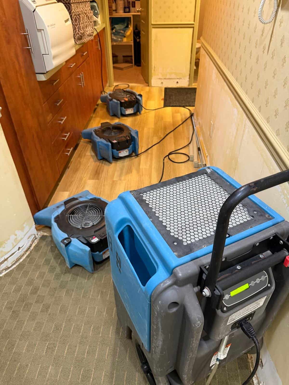 Commercial dehumidifier and air movers drying the lab area of an Armonk, NY dental office