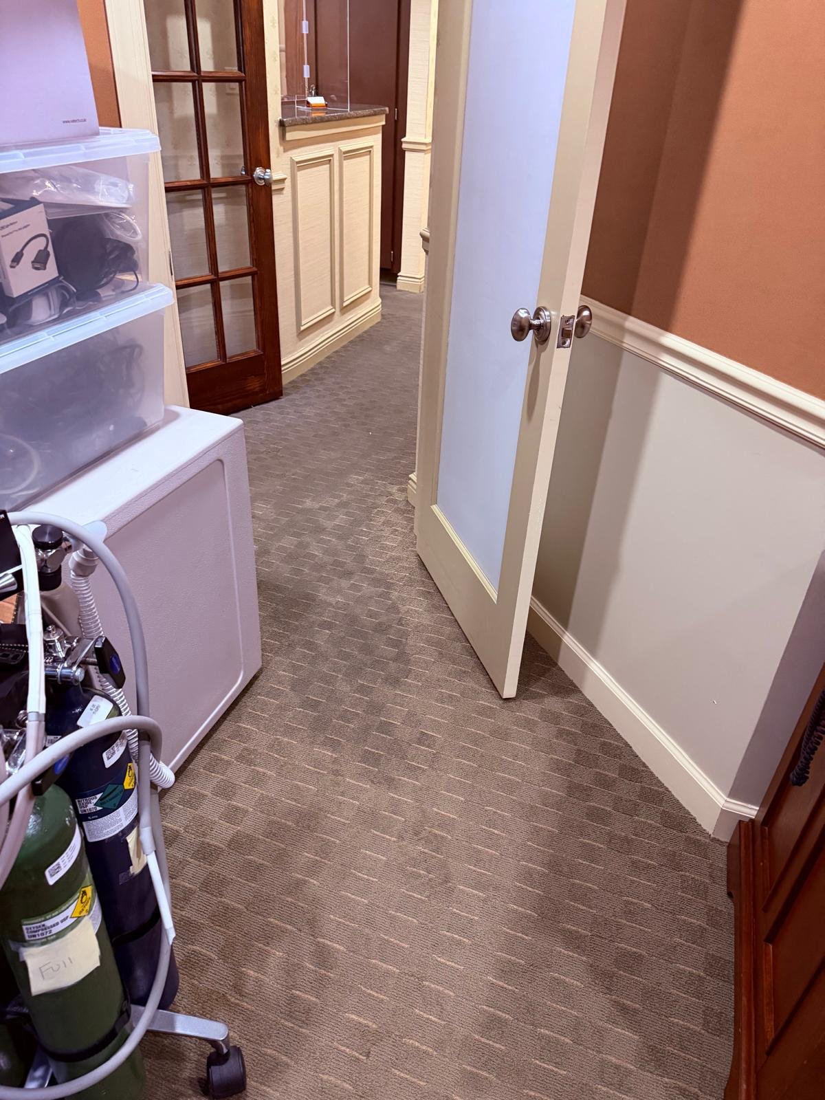 Dental office hallway affected by a broken sink pipe in Armonk, NY